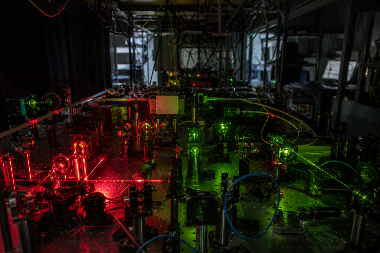 Laser optics and fiber cables on a laboratory table in a Swiss quantum research lab